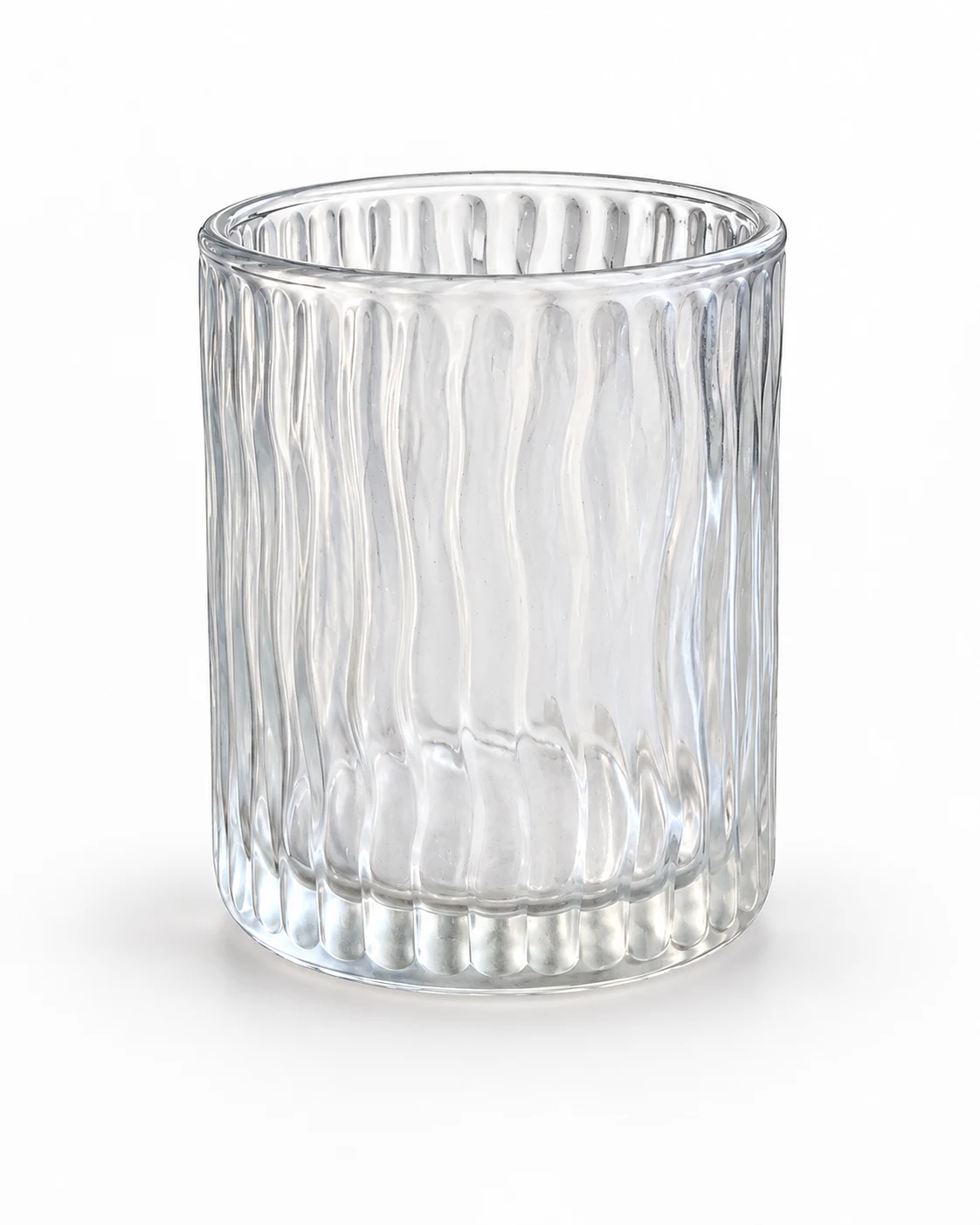 Retouched ribbed glass tumbler on a clean white background